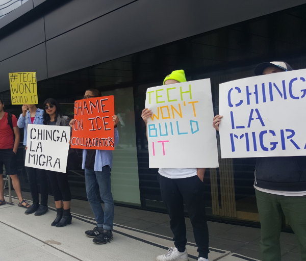 Workers in front of Tableau demand